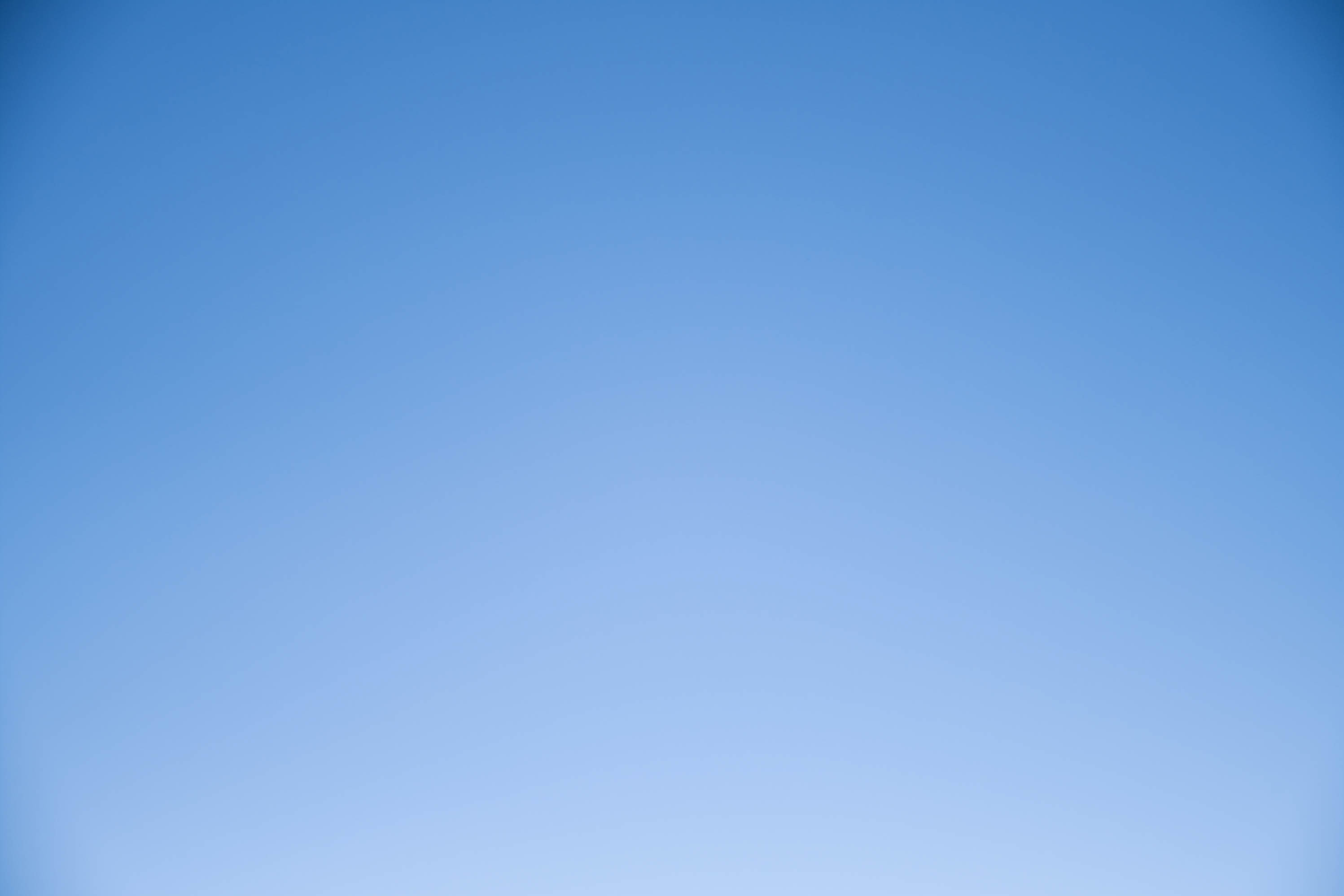 A clear blue sky with no clouds. Description generated by AI