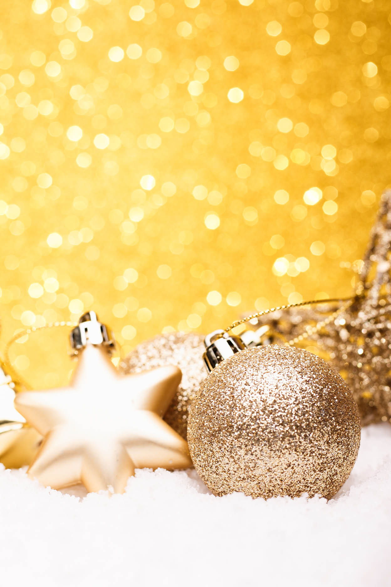 Christmas composition of Christmas tree toys on a gold background.