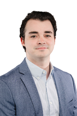 A man wearing a gray suit and striped shirt. Description generated by AI