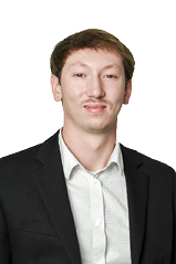 A man wearing a gray suit and striped shirt. Description generated by AI